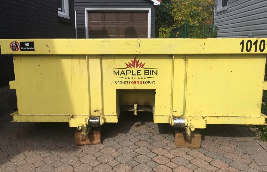 maple bins rental dumpster in driveway